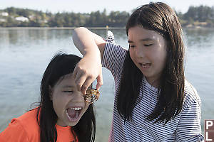 Claira Pretending To Eat Crab