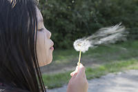 Claira Blowing Dandelion Long Exposure