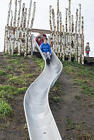 Grandma At The Top Of The Hillside Slide