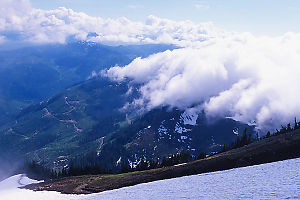 Clouds Crawling Over Mountain