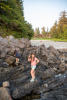 Claira On Rocks In Front Of Resort