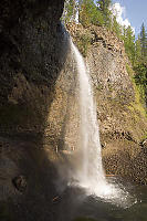 People Walking Behind Moul Falls